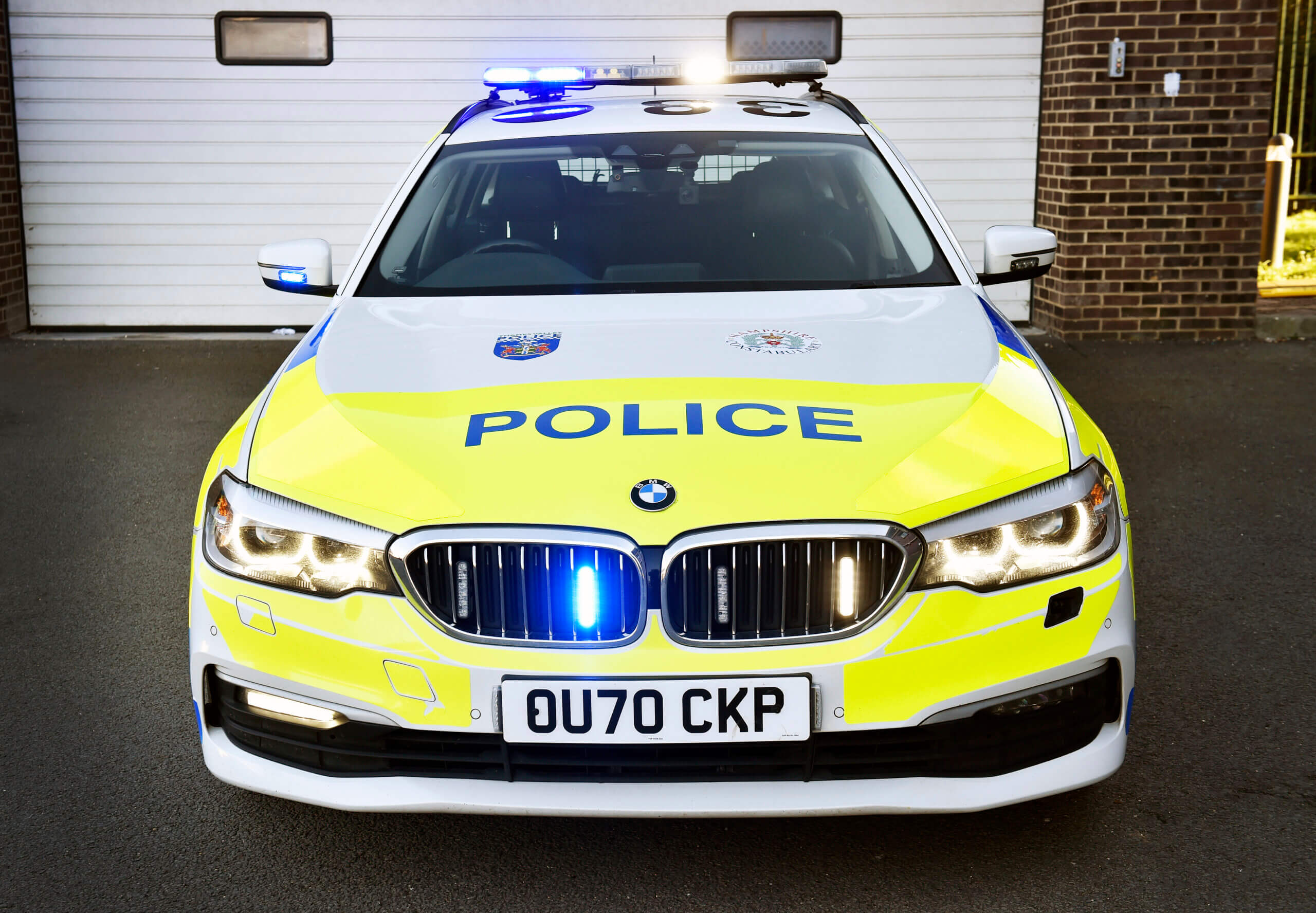 Front view of police car with lights on