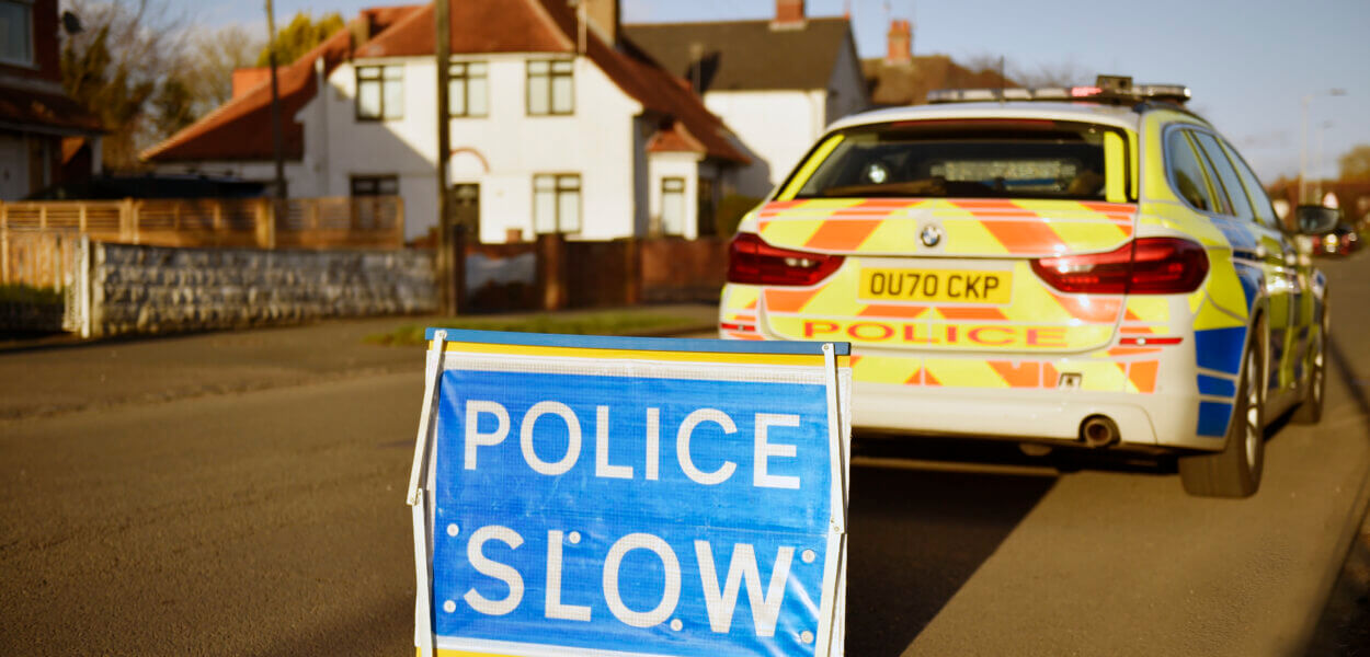 Police slow sign in road