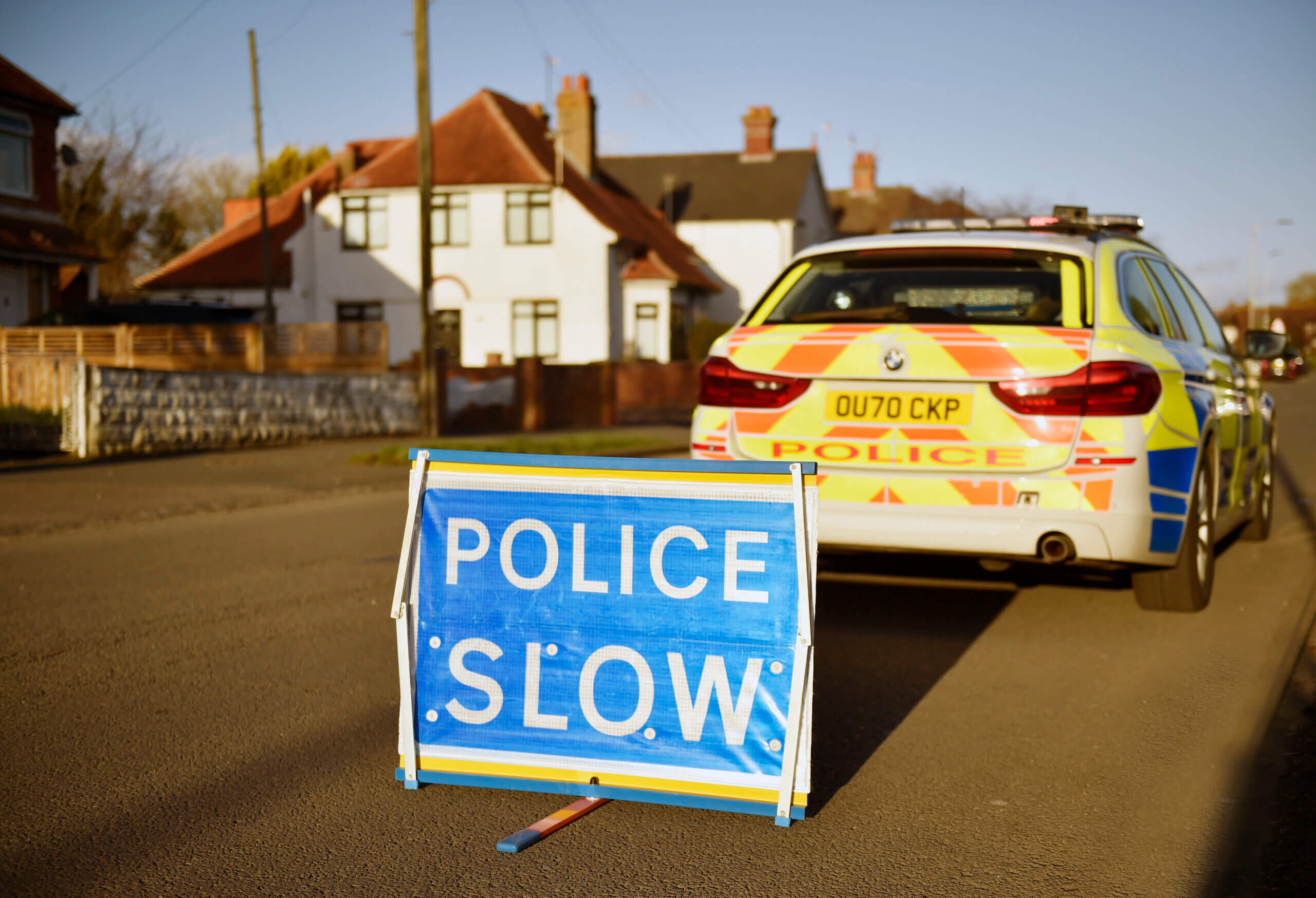 Police slow sign in road