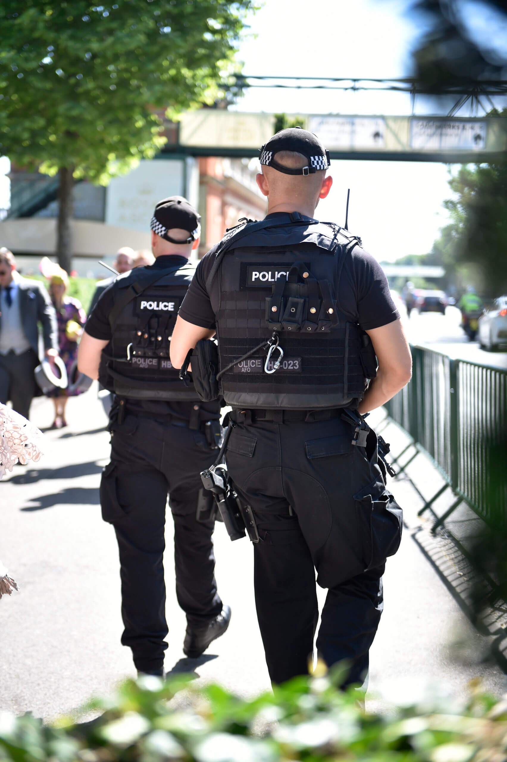 Police officers with caps on in street