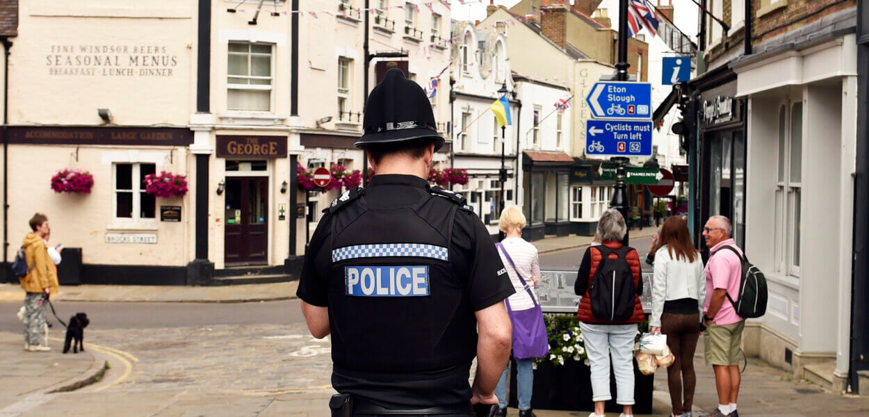 Police officer stood in town centre
