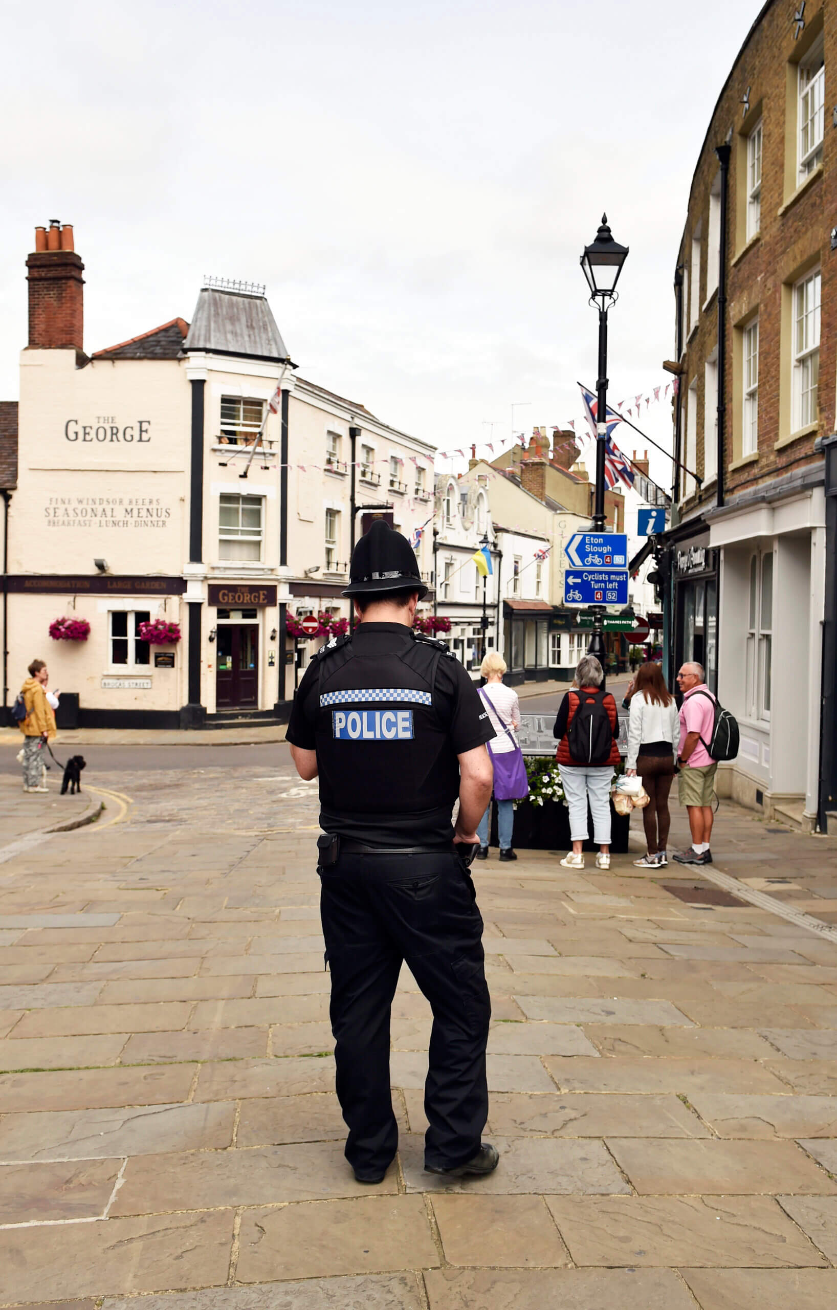 Police officer stood in town centre