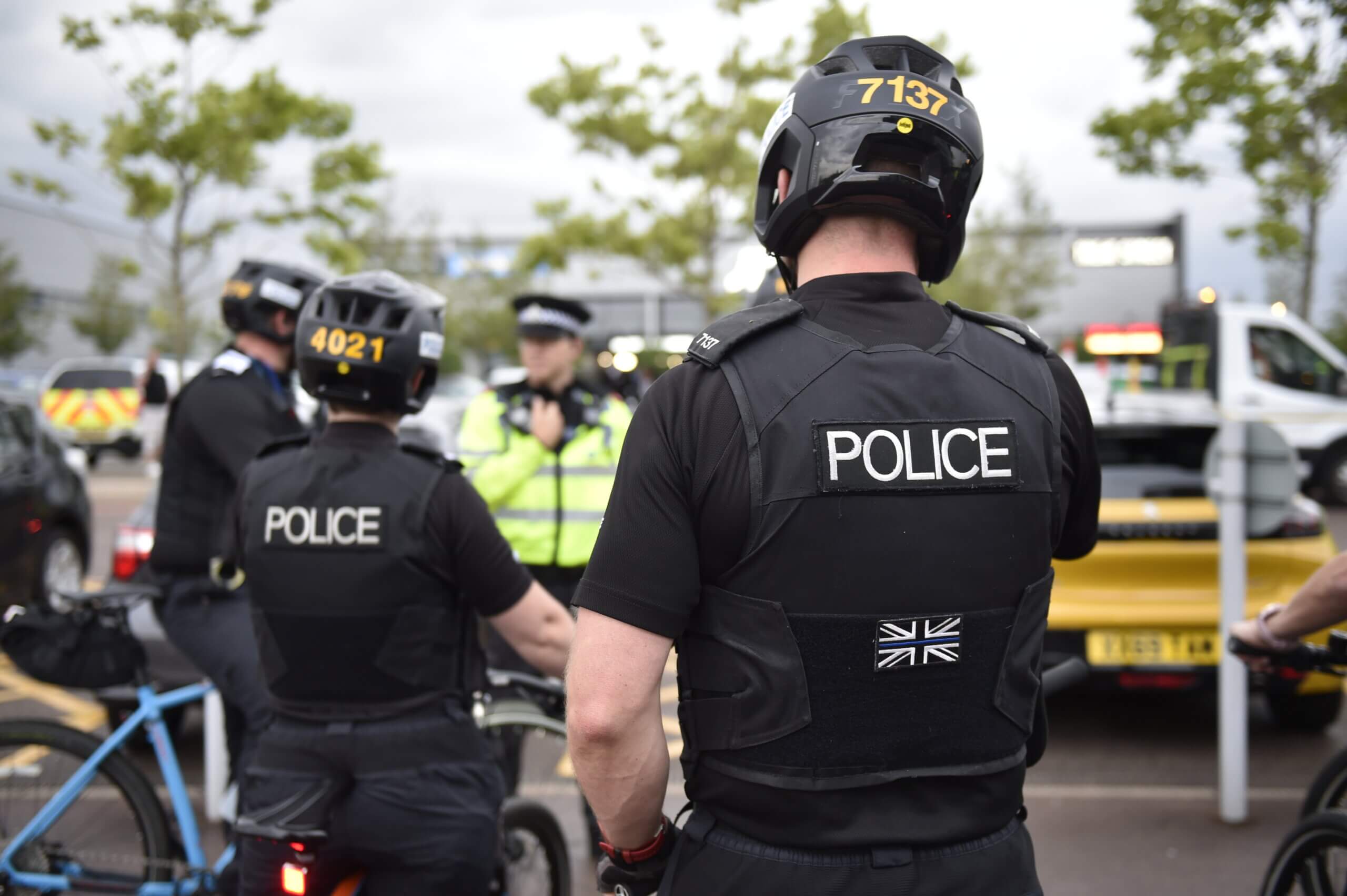 Rear view of uniformed police officers