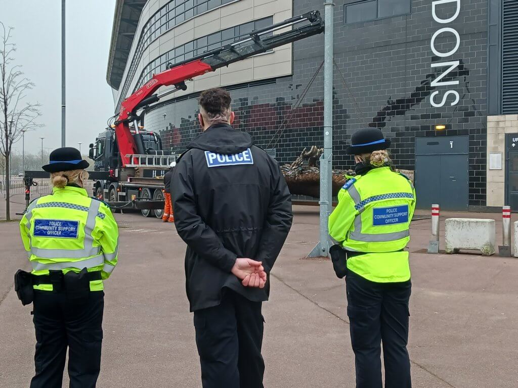 Police officers watching Knife Angel arrive