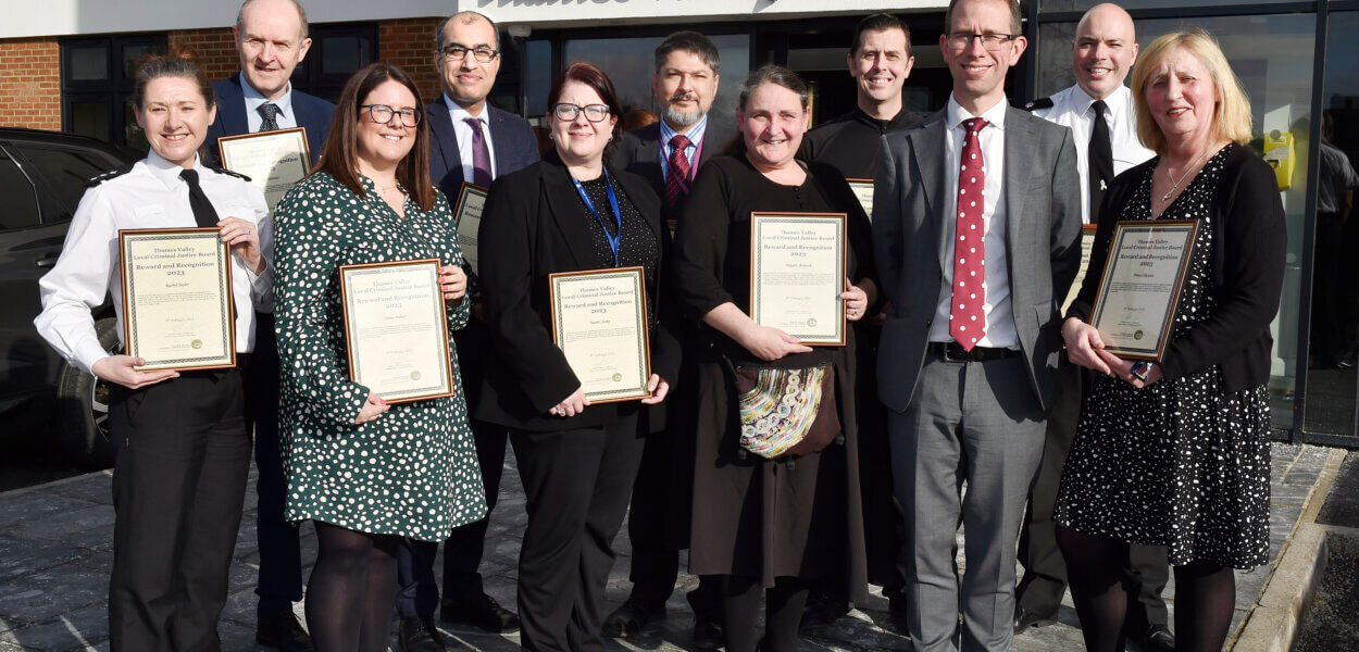 Staff outside with commendations