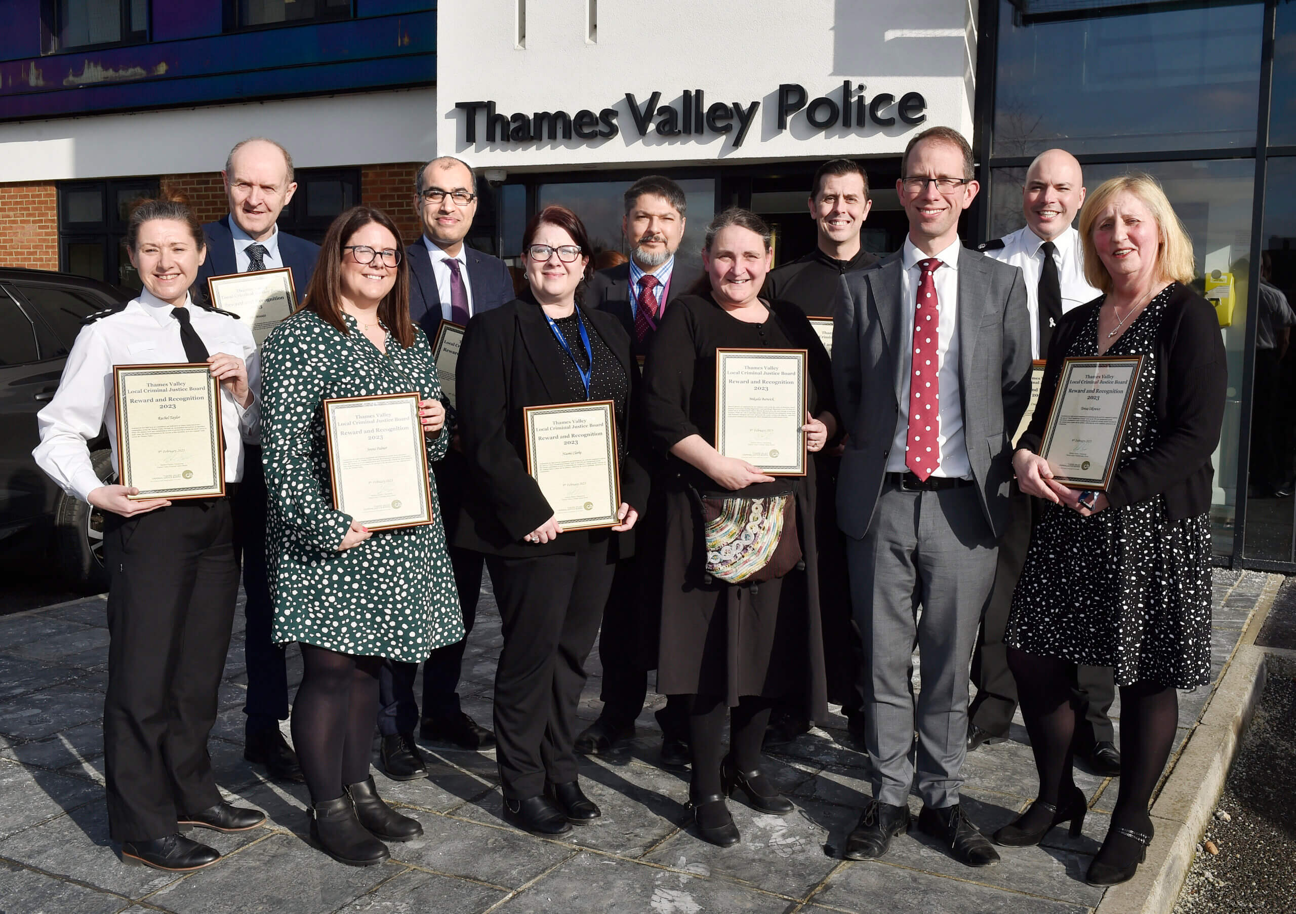 Staff outside with commendations