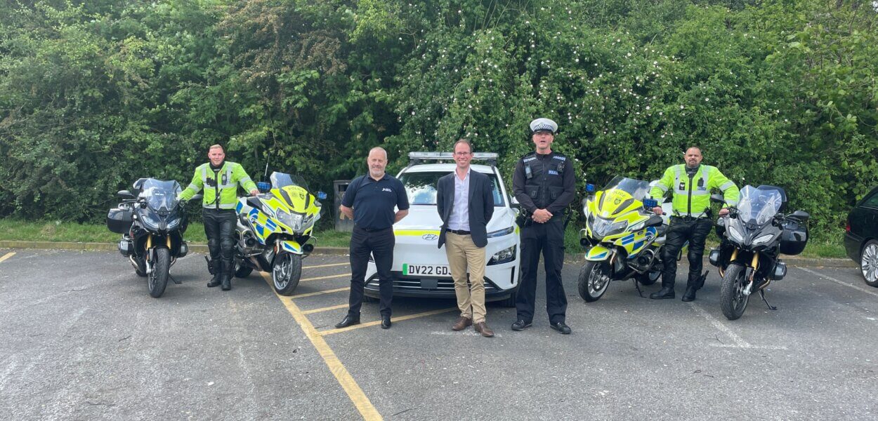 PCC Matthew Barber with 4 roads policing officers, 4 road bikes and a police car