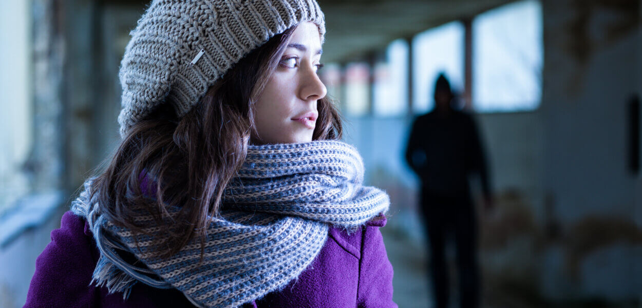 Worried Woman Stalked by a Man