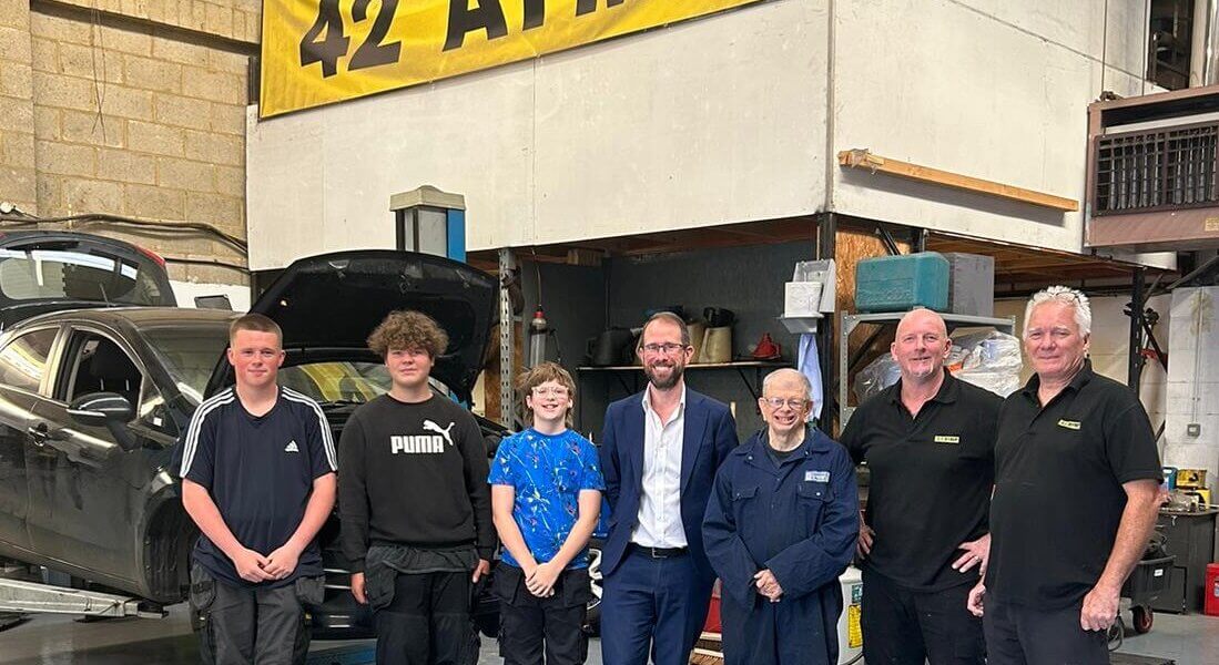 Matthew Barber with students and instructors of Aylesbury Youth Motor Project