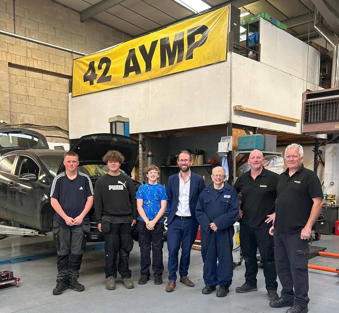 Matthew Barber with students and instructors of Aylesbury Youth Motor Project