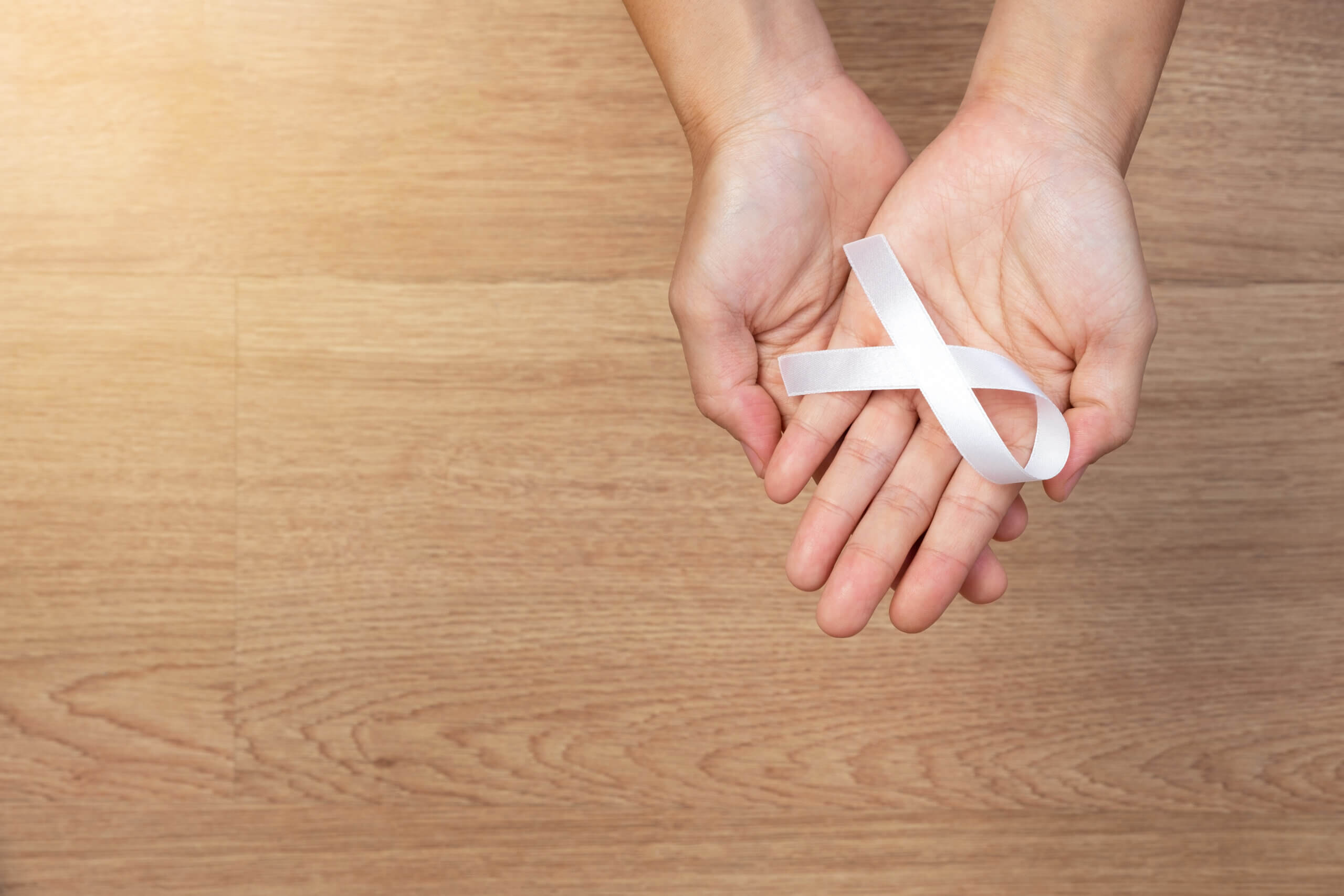 Generic image of person holding a White Ribbon