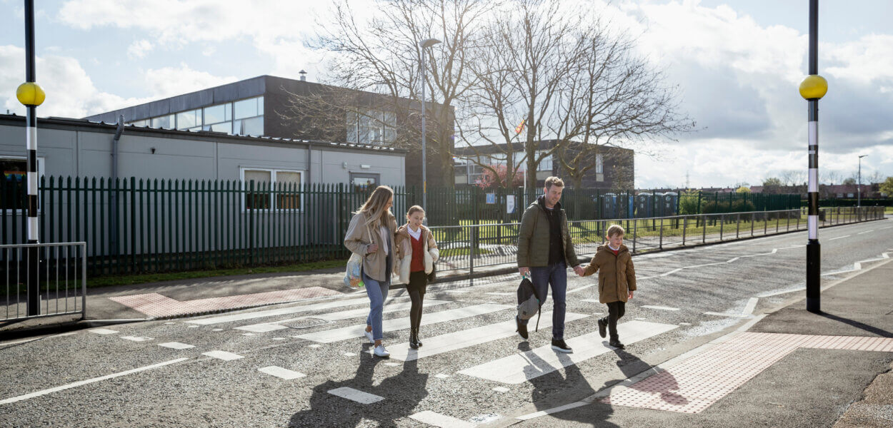 Family Safely Crossing the Road