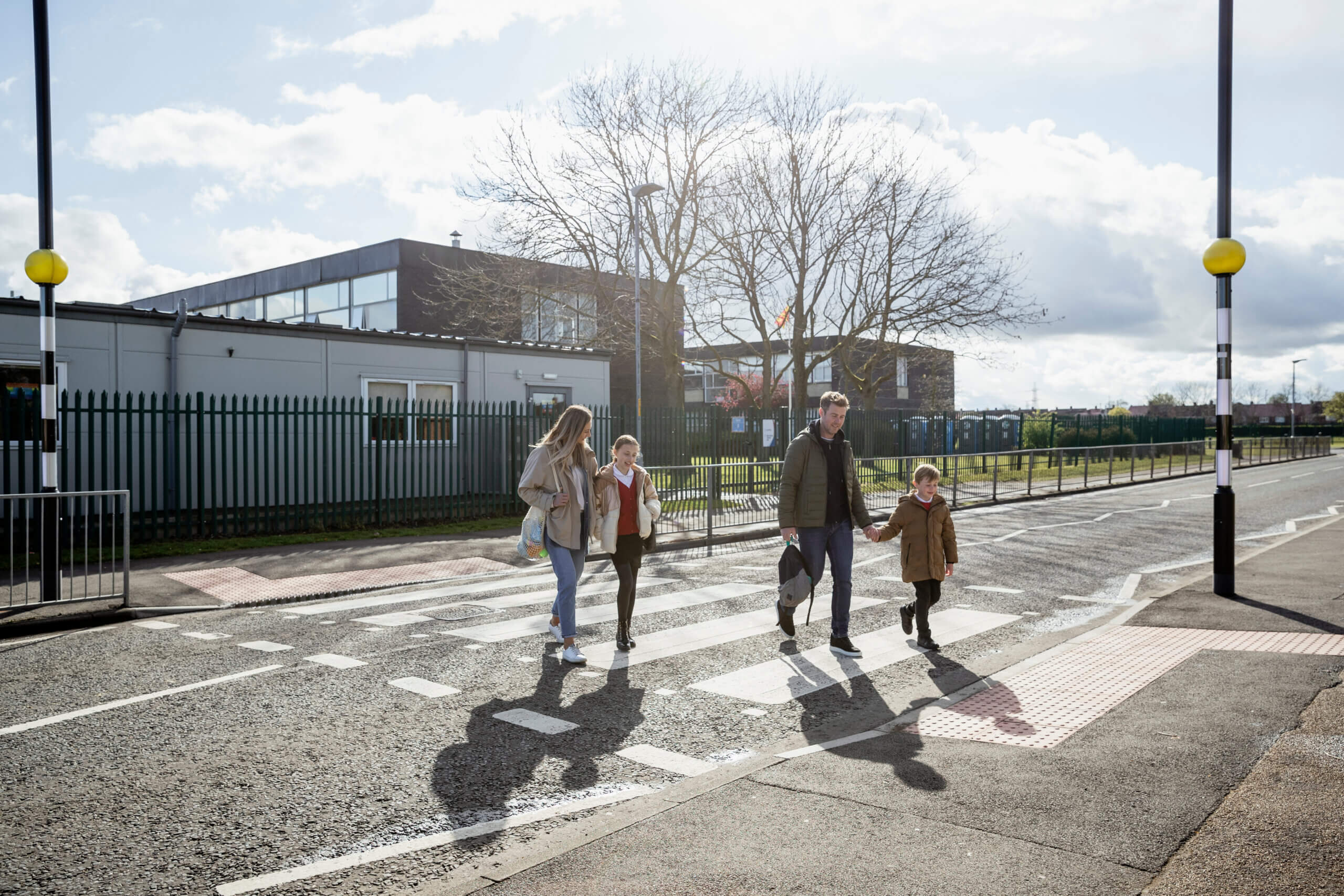 Family Safely Crossing the Road