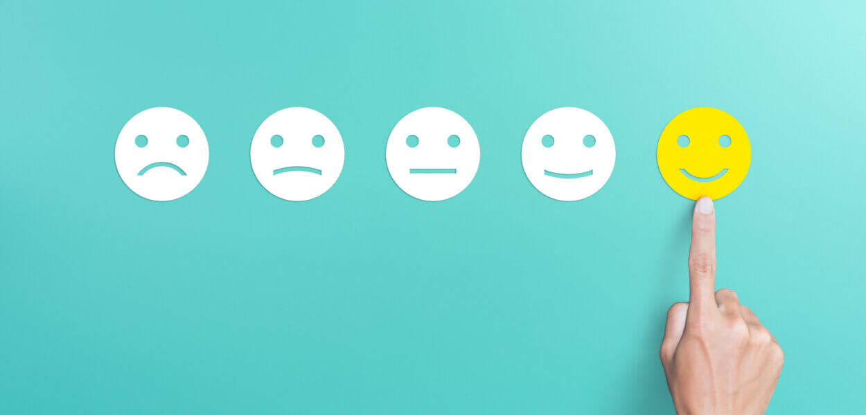 client's hand picked the happy face smile face, Customer service evaluation and satisfaction survey concept. copy space