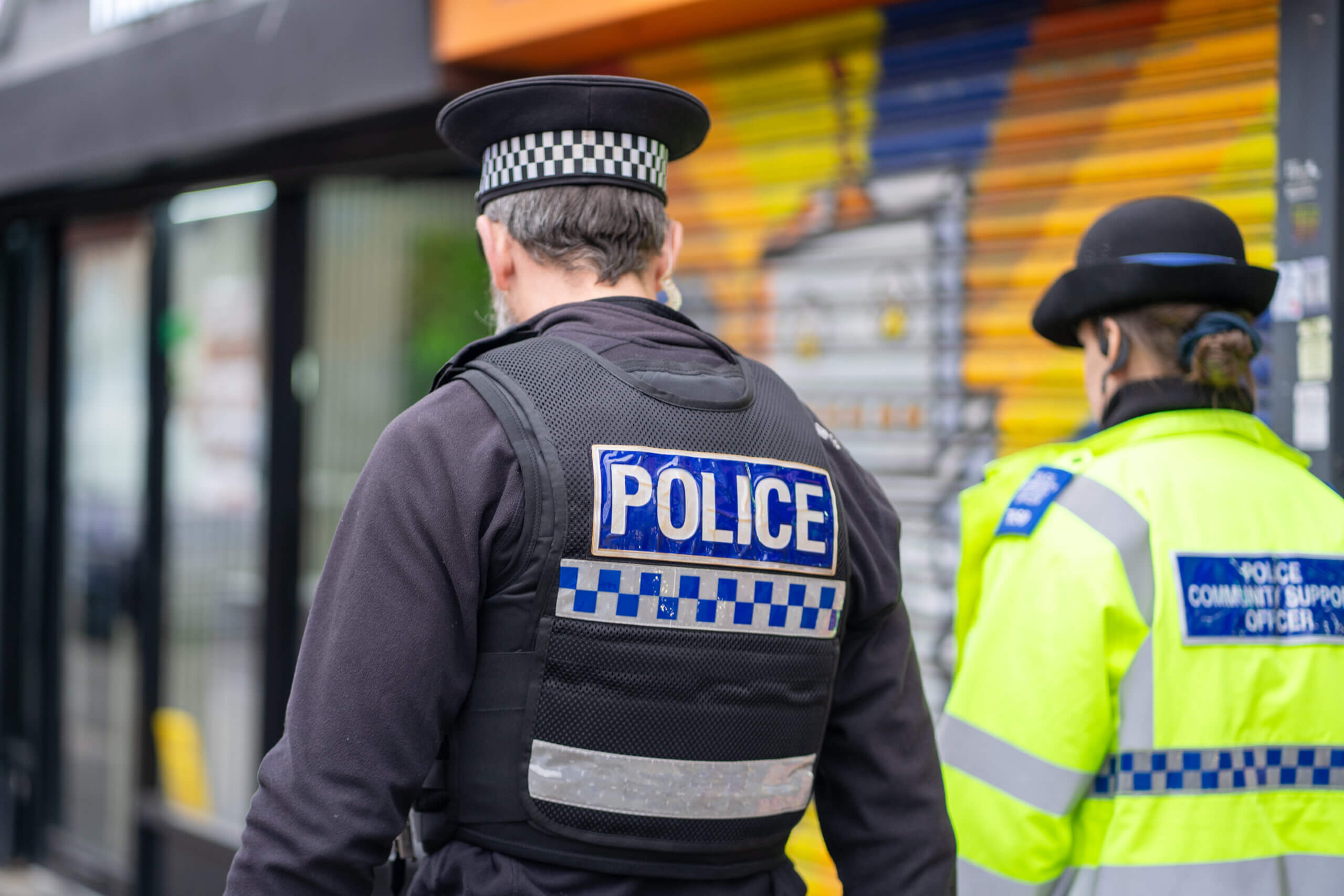 Police officer and PCSO in town centre