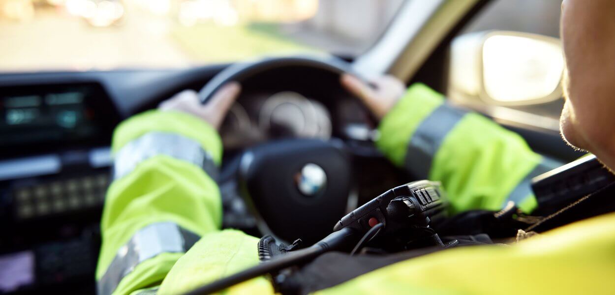 Thames Valley Police Officer driving a Thames Valley Police car